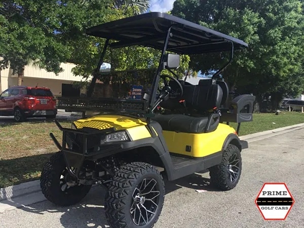 Yellow Aluma 4 Passenger Lifted Golf Cart affordable golf cart rental, golf cart rent doral